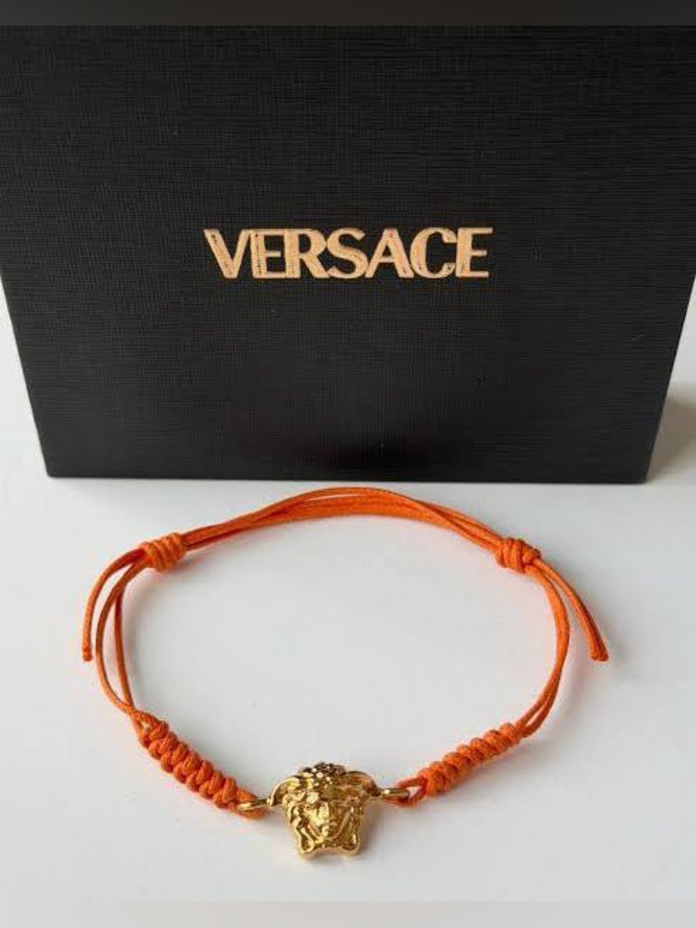 NIB Versace Gold Medusa Charm on Adjustable Orange Cord Bracelet